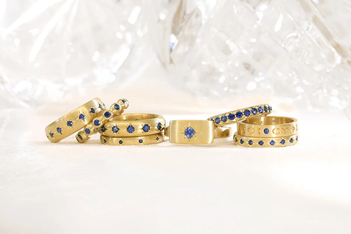 20K Gold Bezel-Set Blue Sapphire Eternity Ball Ring