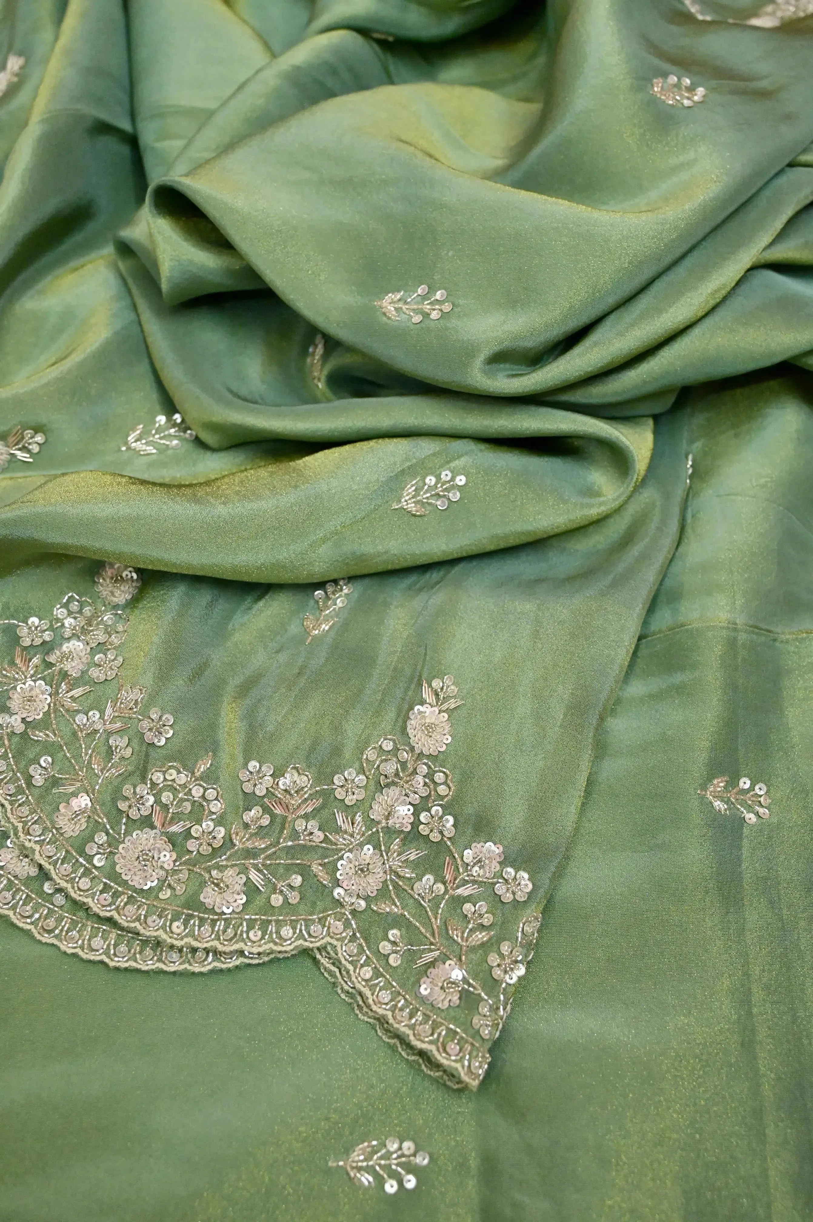 Moss Green Color Georgette Tissue Saree with Hand Zardozi Work and Scallop Border