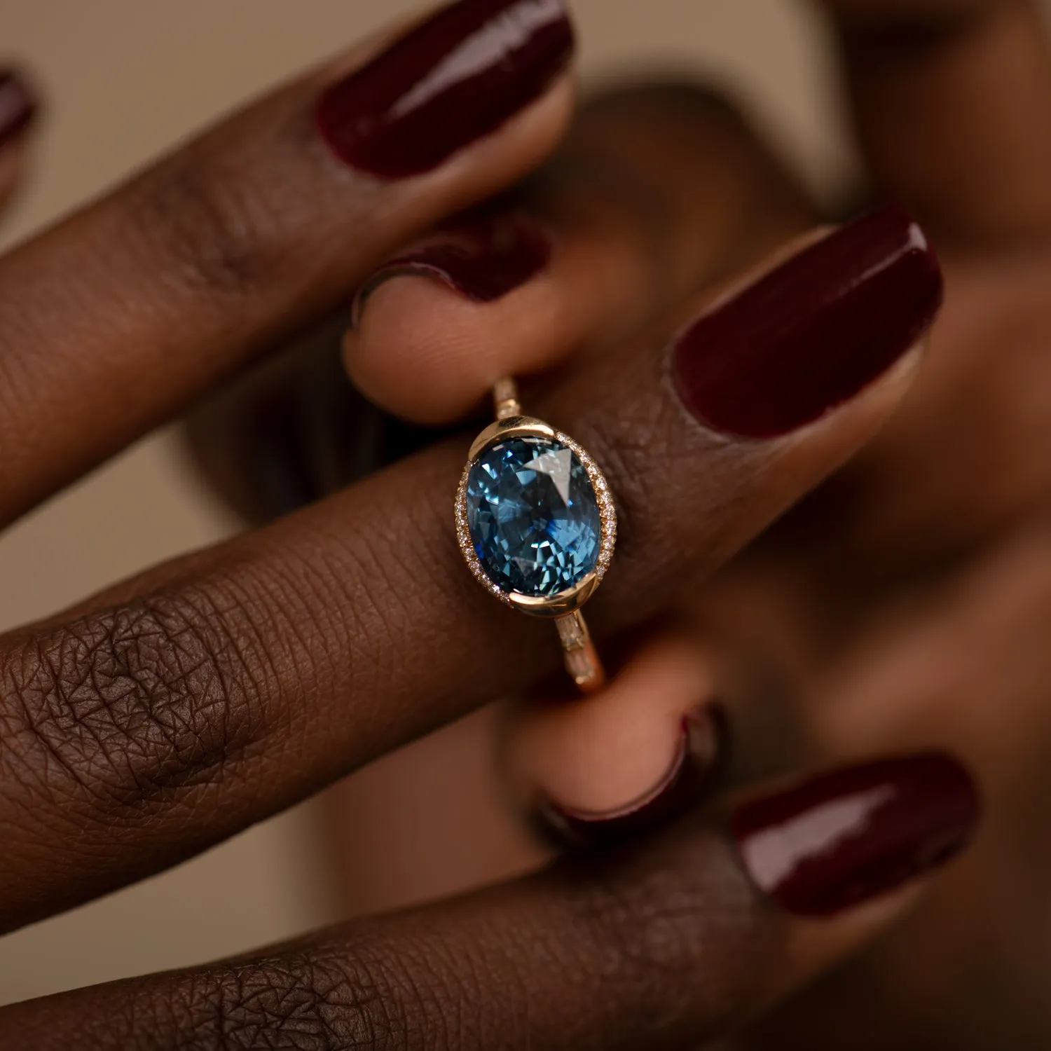 Oval Sapphire Engagement Ring with a Brilliant Diamond Belt