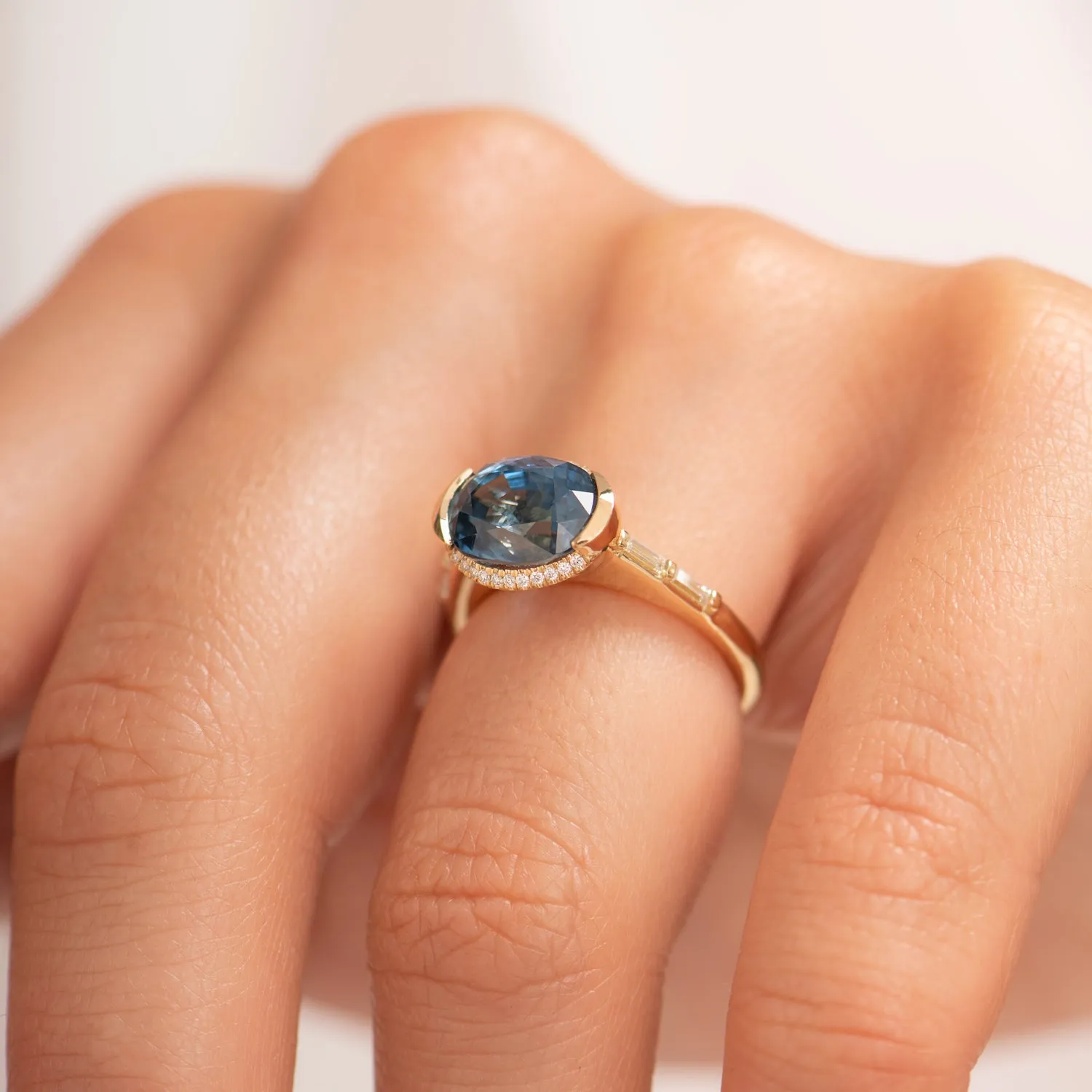 Oval Sapphire Engagement Ring with a Brilliant Diamond Belt