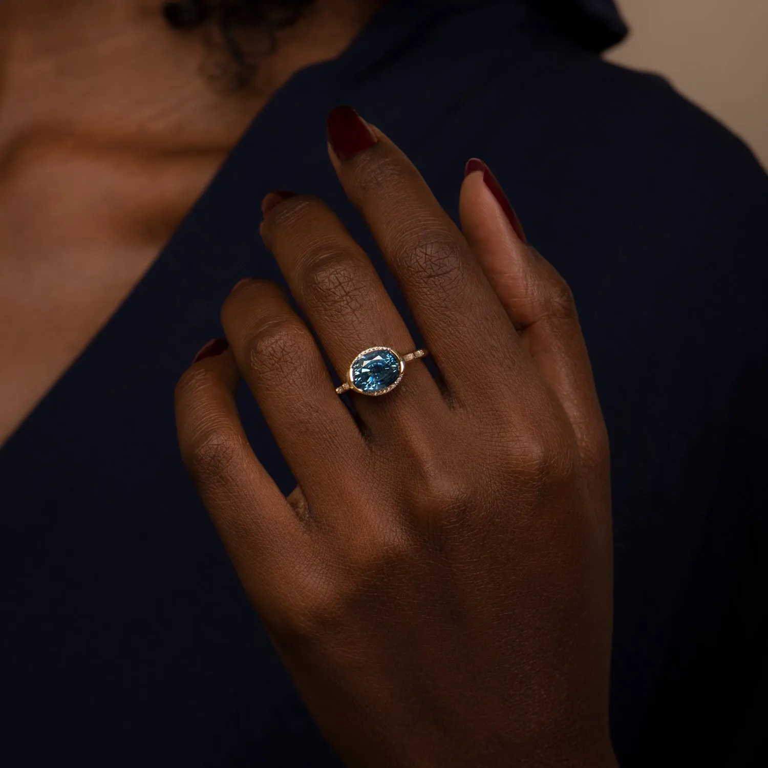 Oval Sapphire Engagement Ring with a Brilliant Diamond Belt